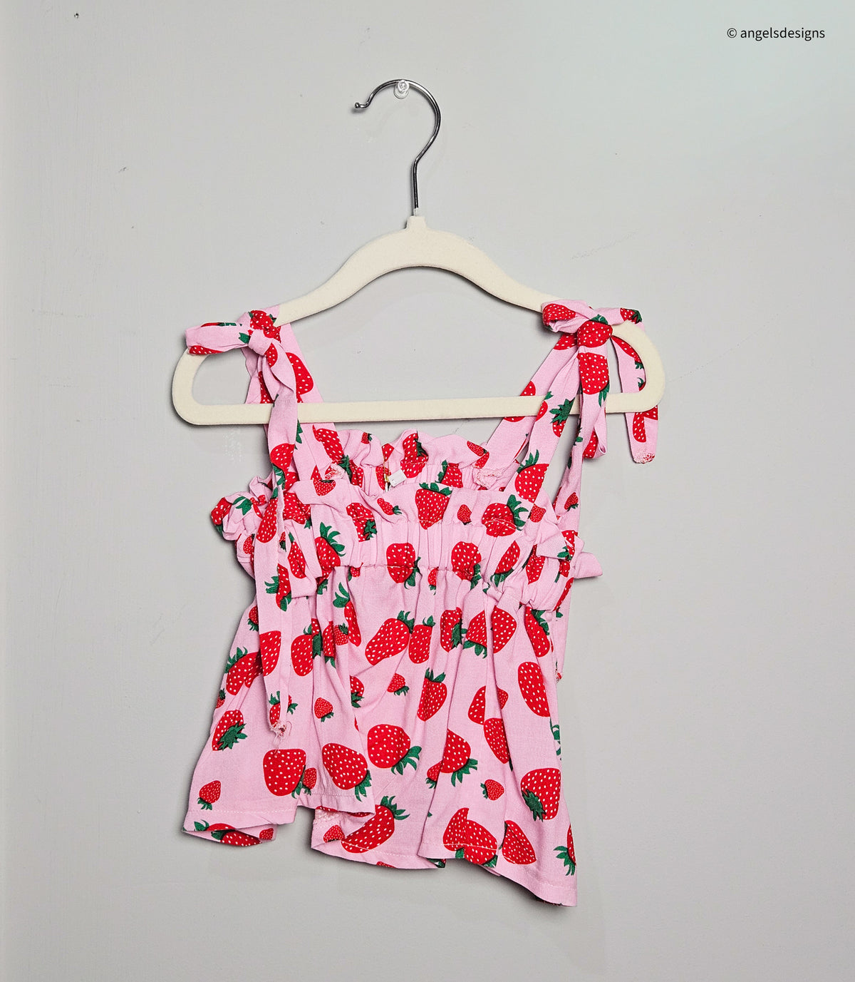Girl's ruffled strap tie tank top