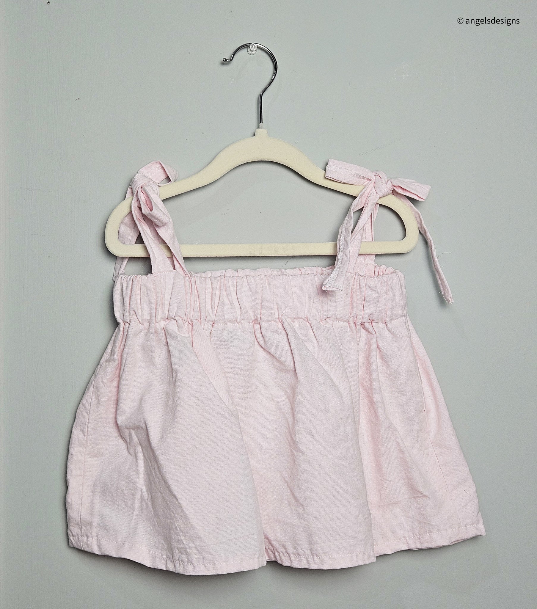 Girl's ruffled strap tie tank top