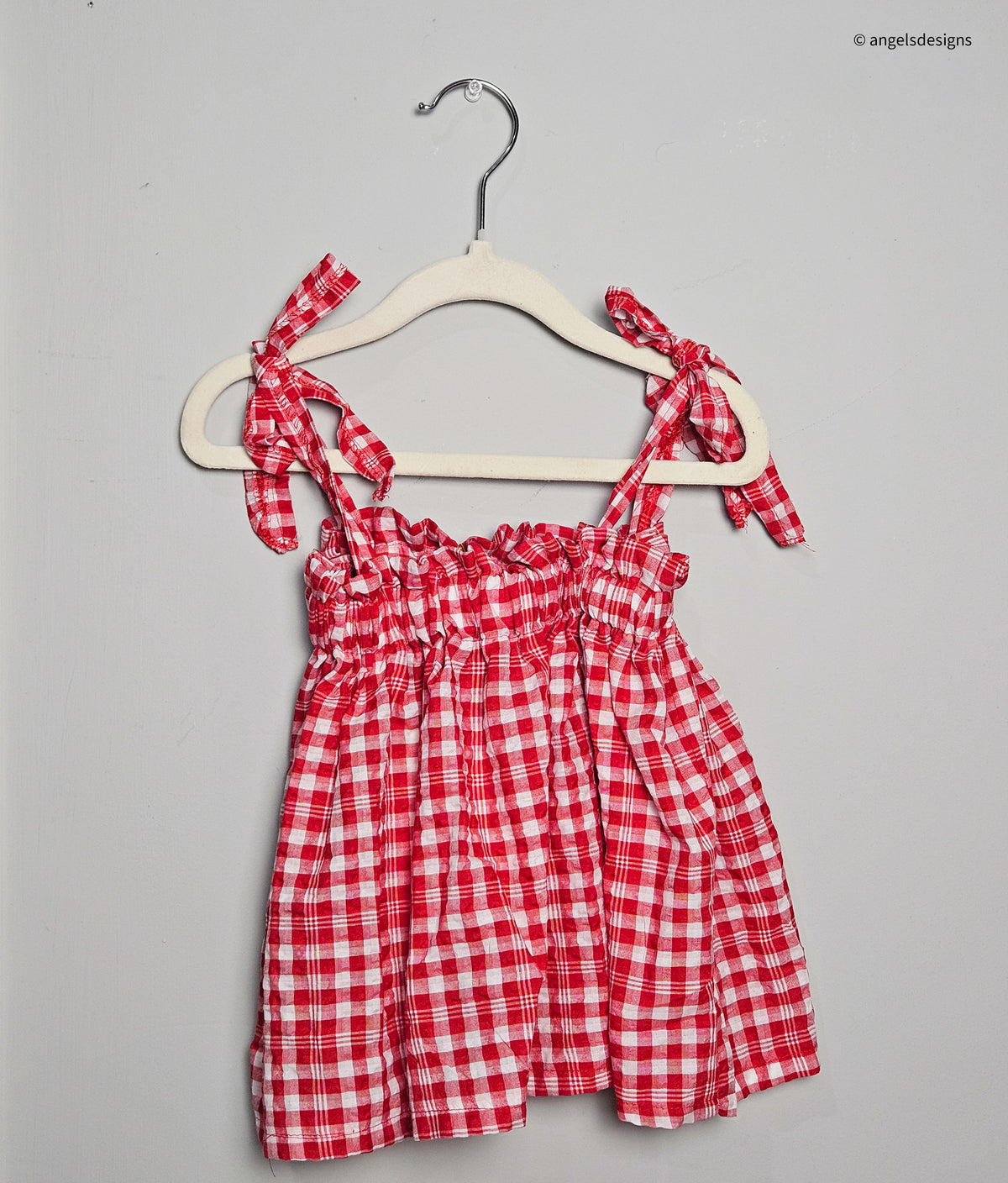 Girl's ruffled strap tie tank top