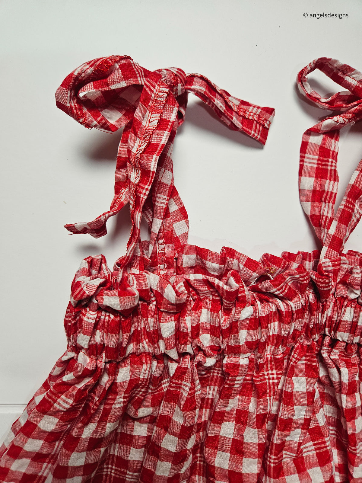 Girl's ruffled strap tie tank top