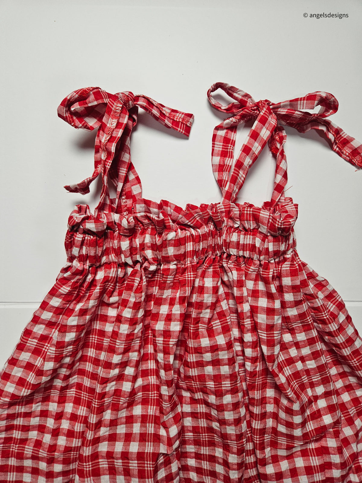 Girl's ruffled strap tie tank top