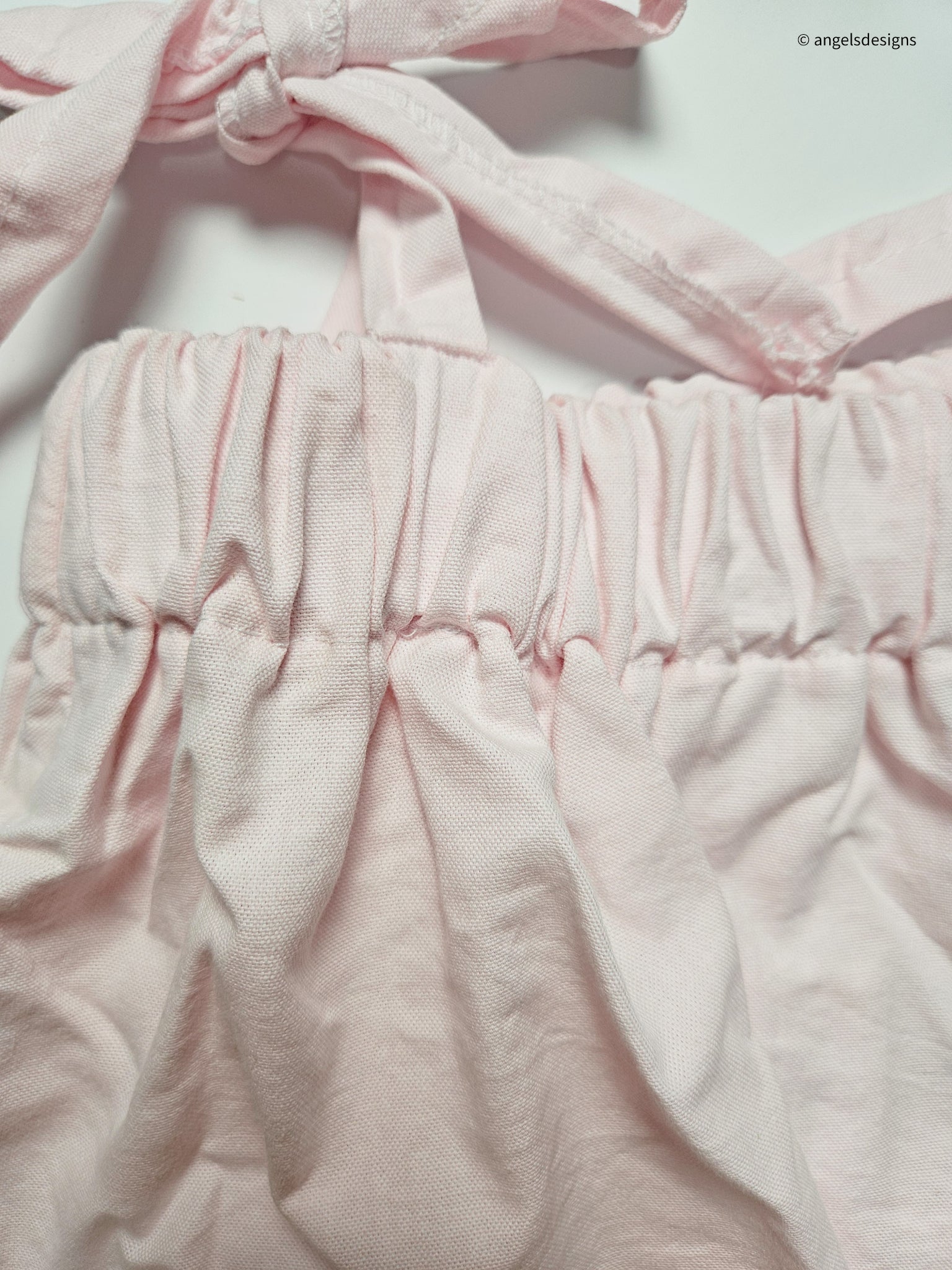 Girl's ruffled strap tie tank top