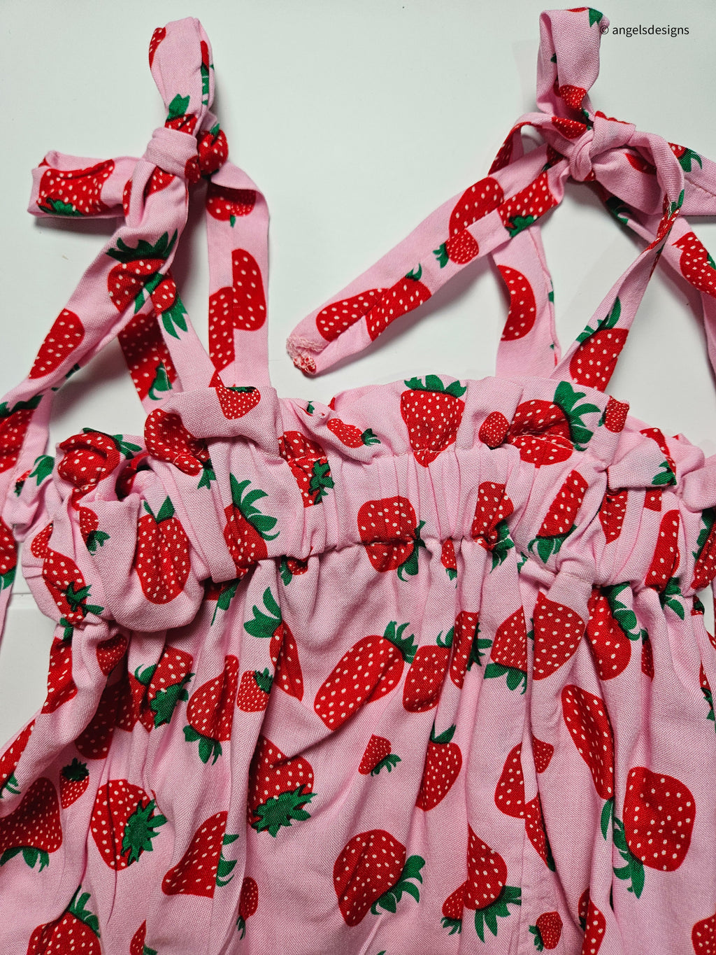 Girl's ruffled strap tie tank top